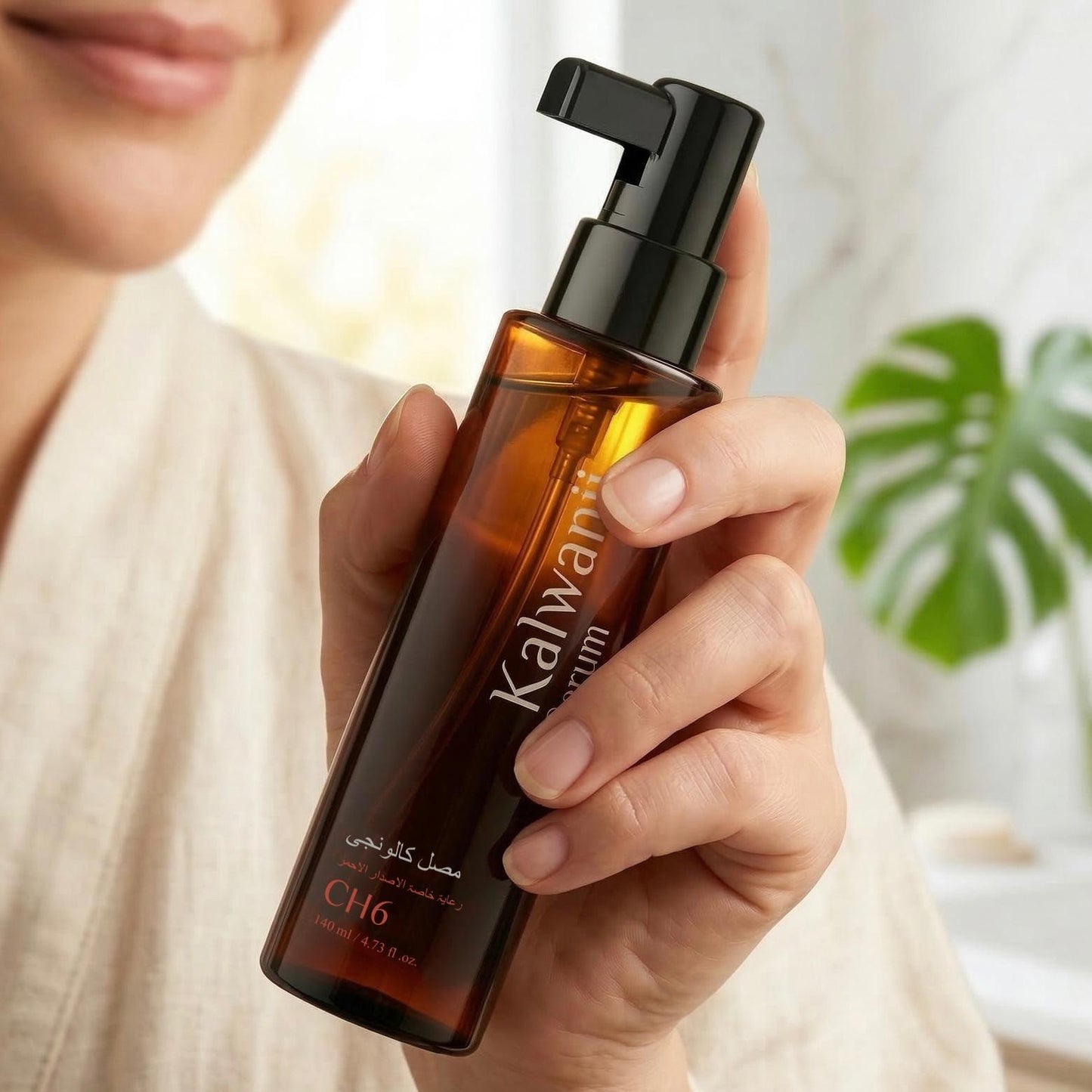 WAFA Kalwanji hair serum held in hand